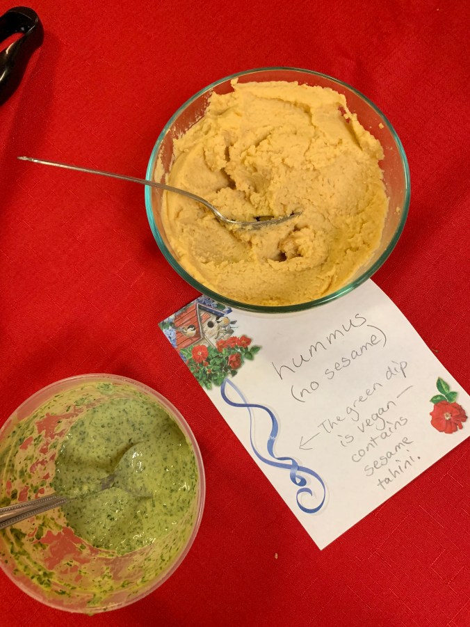 "Hummus--no sesame. The green dip is vegan--contains sesame tahini."