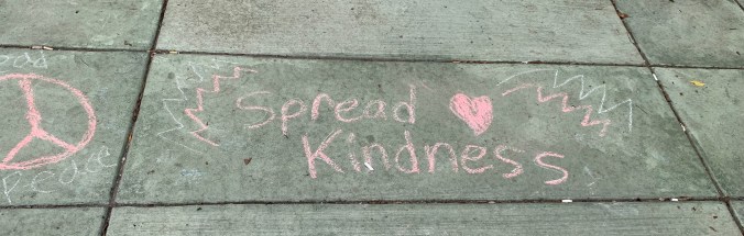sidewalk chalk "Spread Kindness," peace sign, heart