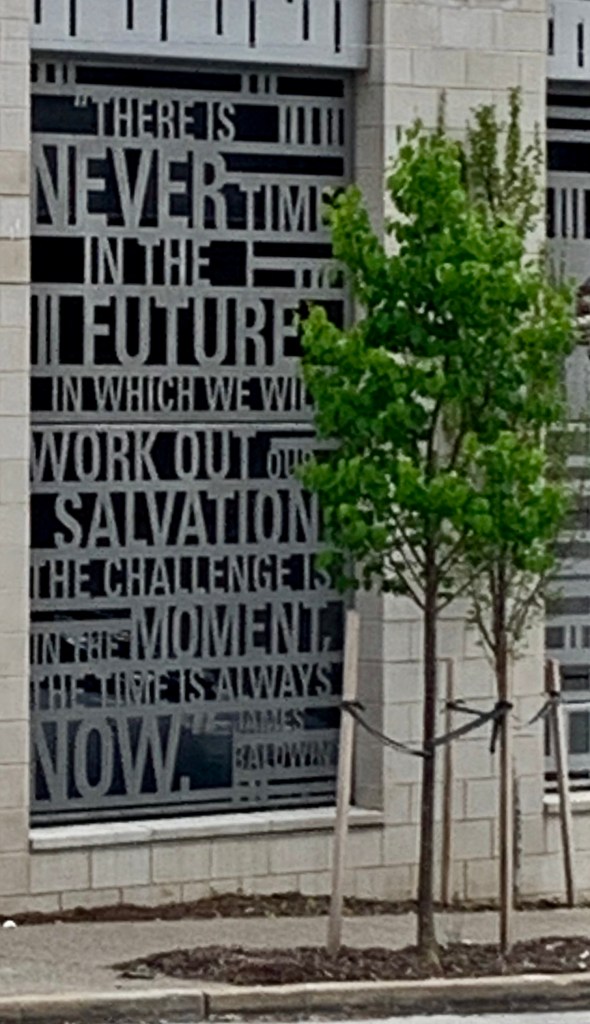 metal words in window of parking garage